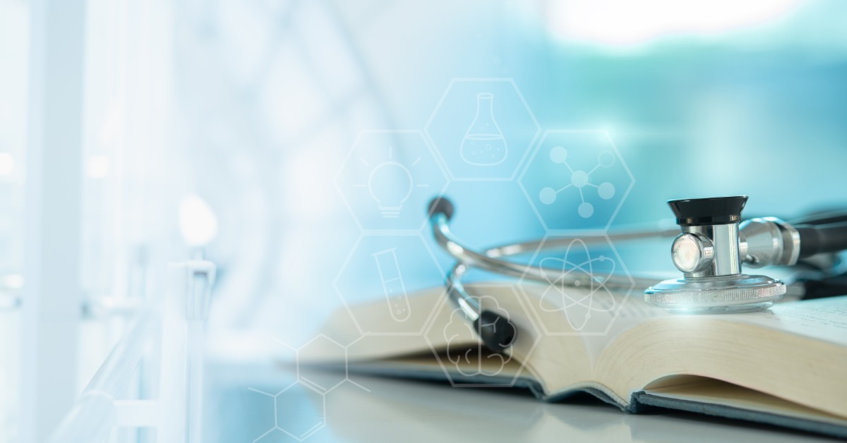 A stethoscope rests on an open medical textbook with science icons overlay, representing healthcare education and certification.